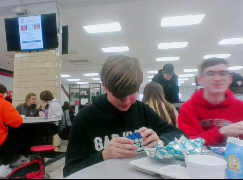 9th grader Seth Johnson plays with his Rubix Cube.